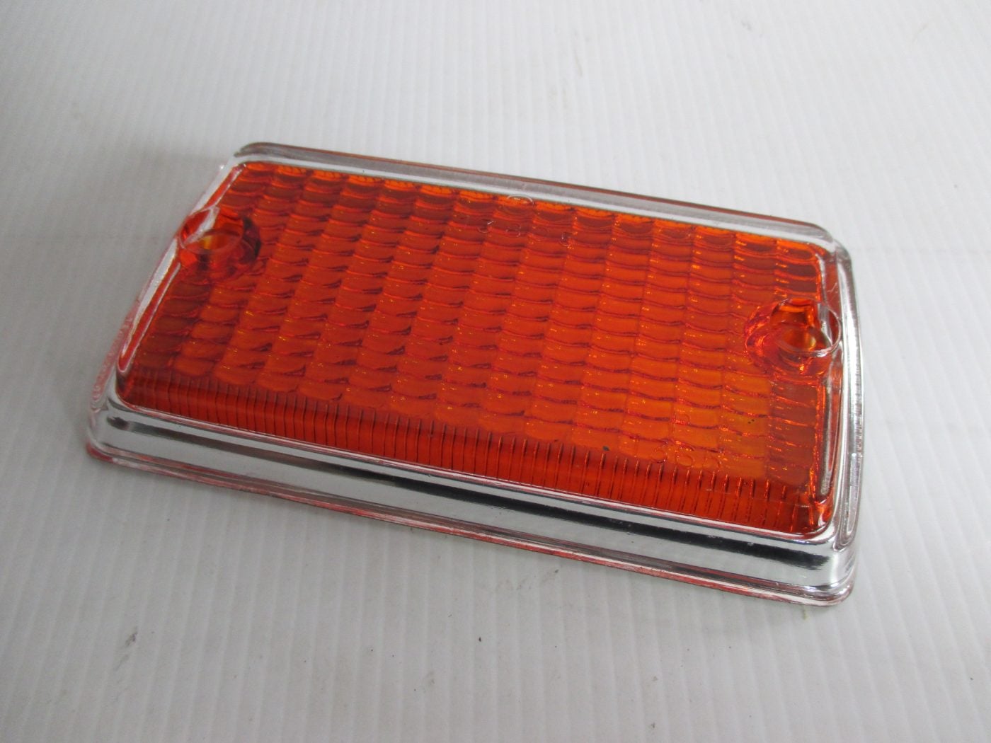 ESCORT MK1,FRONT INDICATOR LENS WITH CHROME PAINTED SURROUND