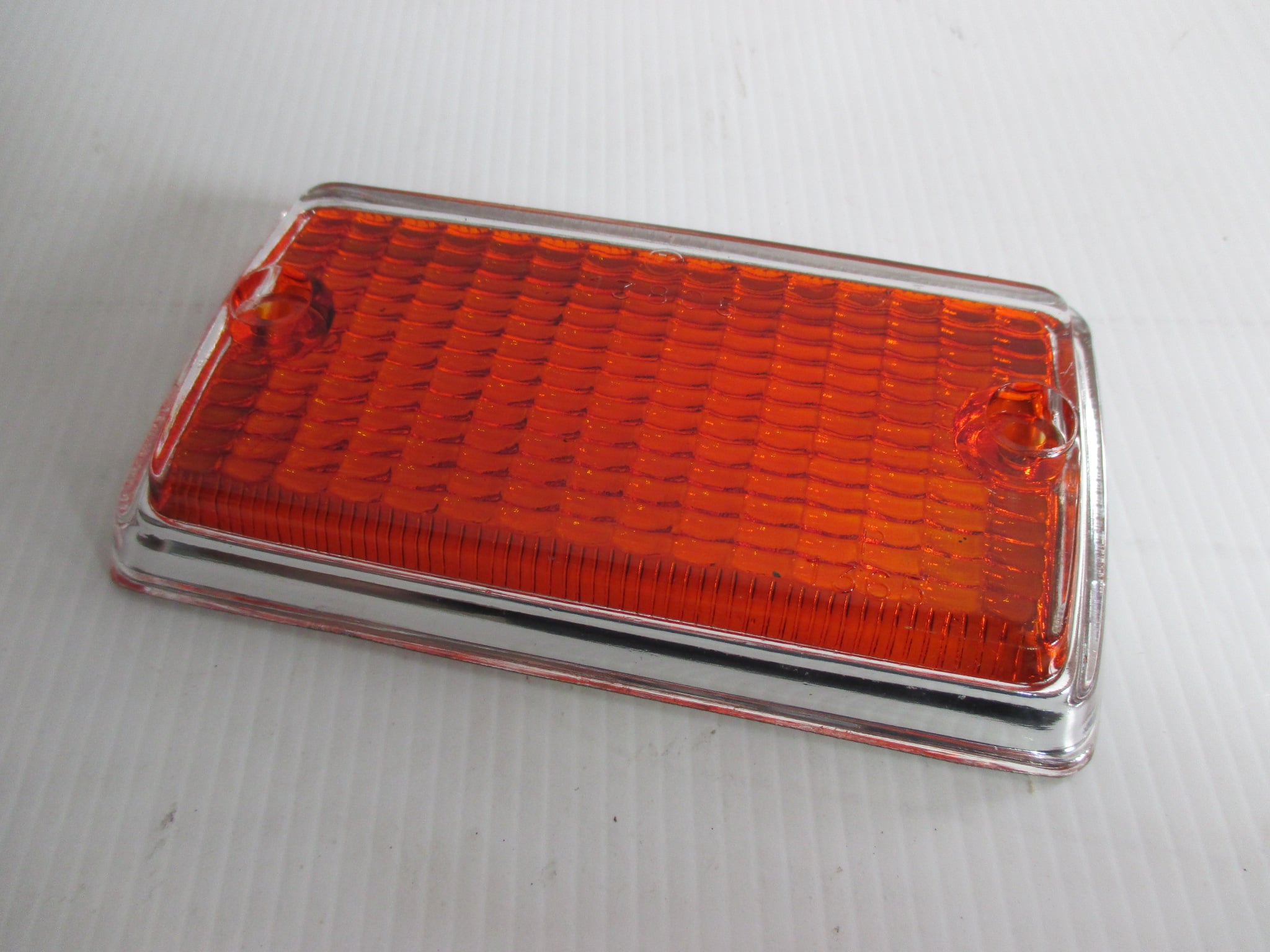 ESCORT MK1,FRONT INDICATOR LENS WITH CHROME PAINTED SURROUND