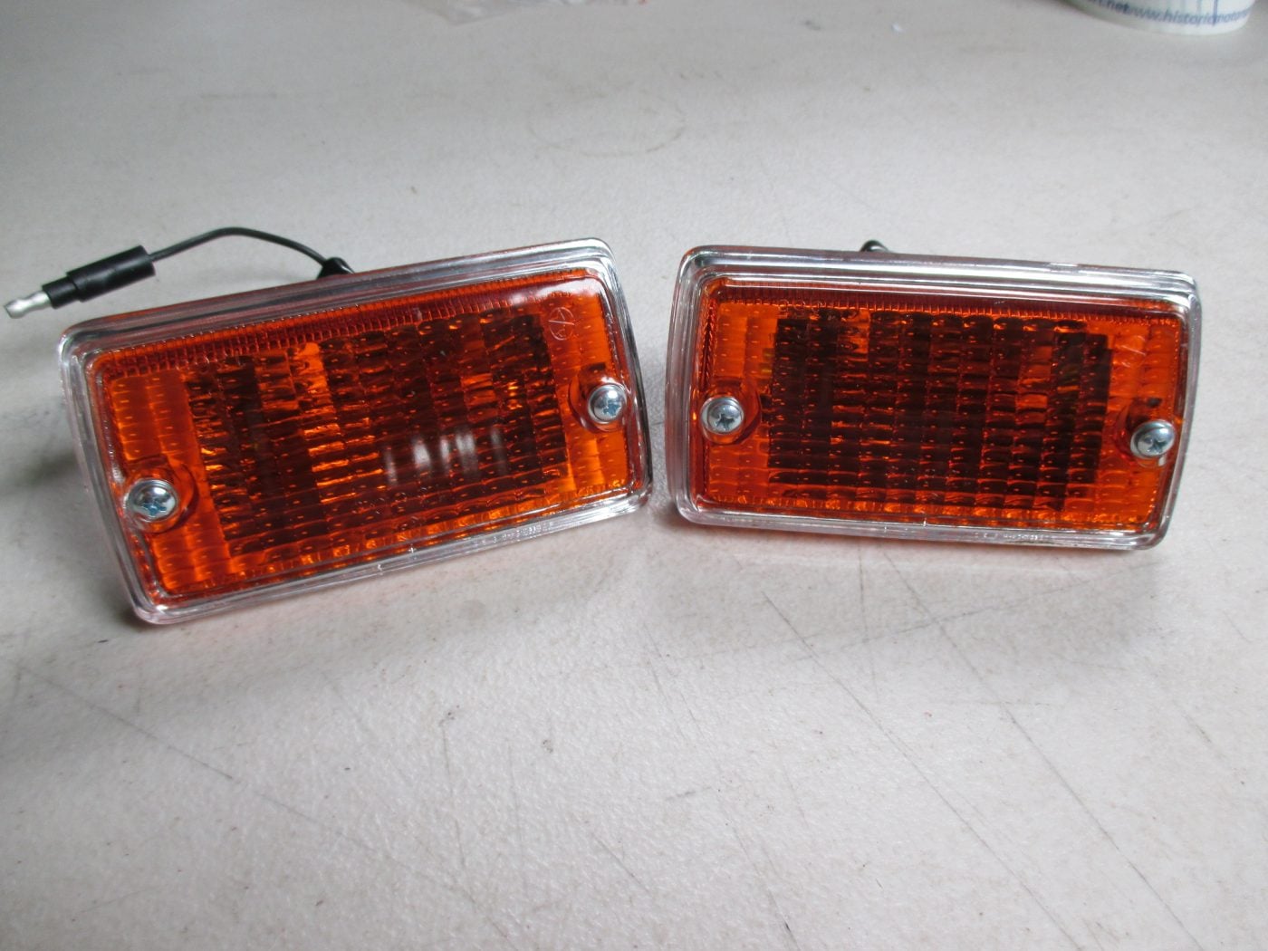 PAIR OF MK1 ESCORT, FRONT INDICATORS WITH CHROME SURROUND LENSES