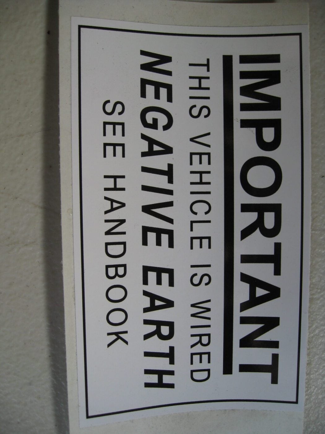 MK1 ESCORT, UNDER BONNET NEGATIVE EARTH STICKER